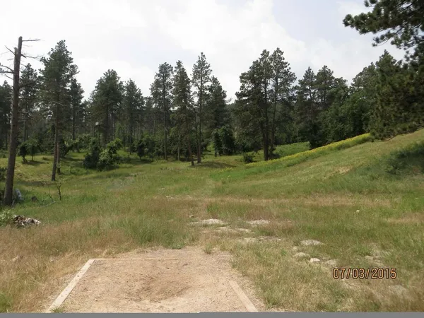 Spearfish Canyon DGC: Hole 8 · Tee pad · Jul 2015, photo by Vey Thach