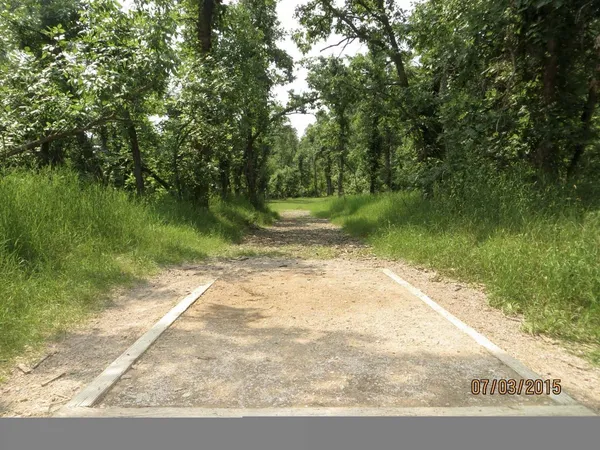 Spearfish Canyon DGC: Hole 1 · Tee pad · Jul 2015, photo by Vey Thach